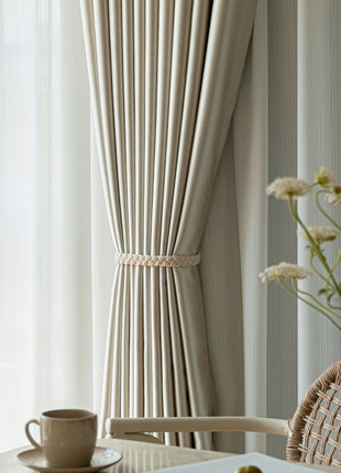 a vase of flowers sitting on a table next to a window