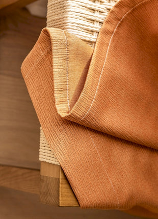 a close up of a piece of cloth on a chair