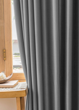 a wooden table with a bowl of flowers on top of it