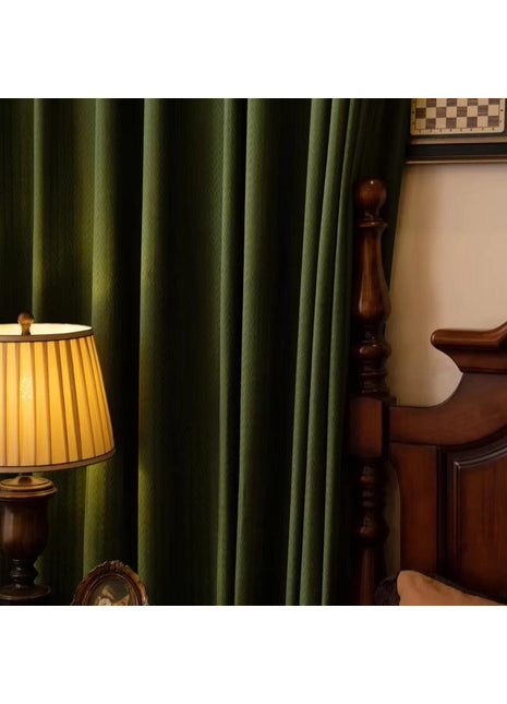 a lamp sitting on top of a table next to a bed