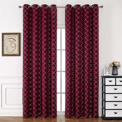 a living room with a window covered in red curtains