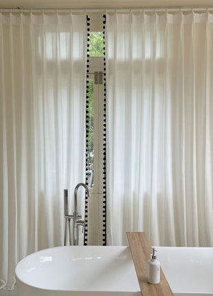 a white bath tub sitting next to a window