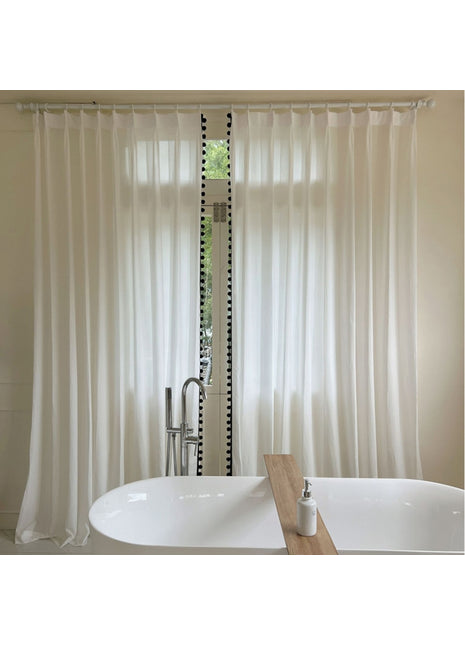 a white bath tub sitting next to a window