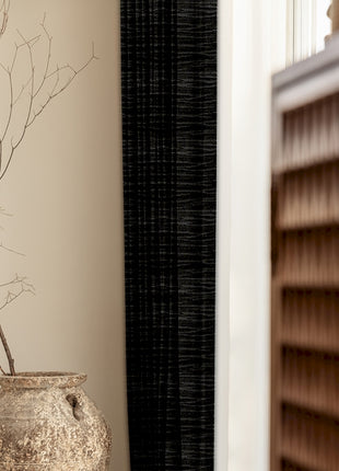 a vase sitting on a table next to a window