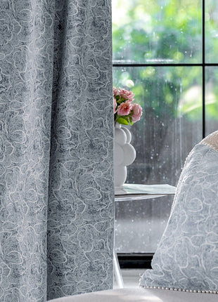 a white chair sitting in front of a window