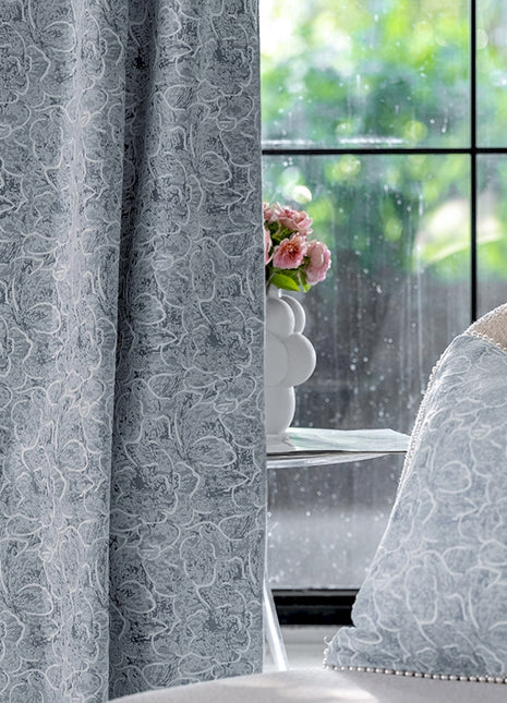 a white chair sitting in front of a window