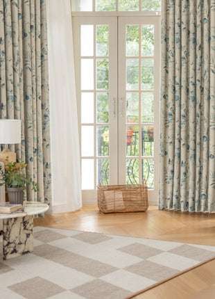 a living room filled with furniture and a large window