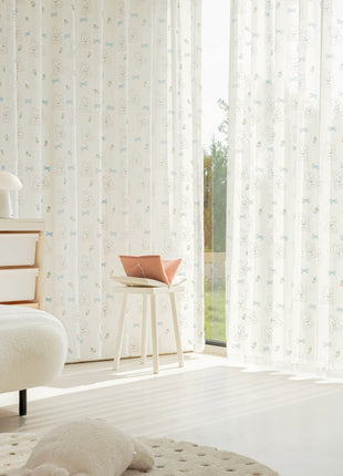 a bedroom with a white bed and a white rug