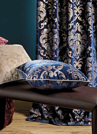 a bed with a bunch of pillows on top of it