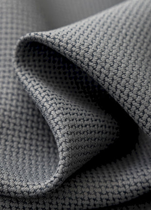 a close up of a tie on a bed