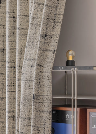 a room with a shelf and a window with a curtain