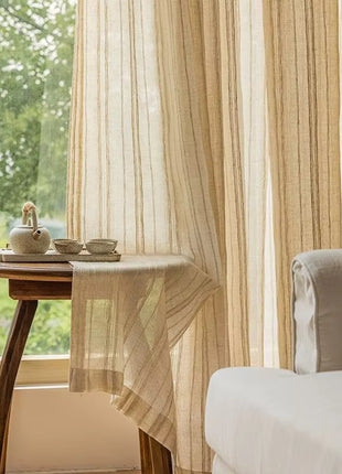 a small table with a cup on it next to a window