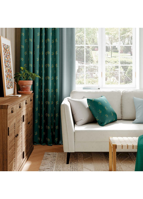 a living room with a white couch and green curtains