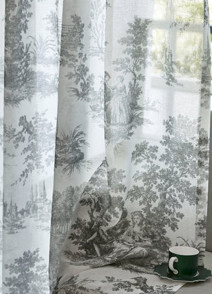 a cup of coffee sitting on top of a couch next to a window