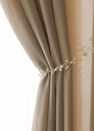 a close up of a curtain with flowers on it