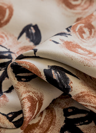 a close up of a fabric with a flower pattern