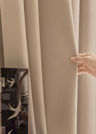 a person opening a curtain with their hand