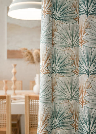 a room with a table, chairs and a curtain