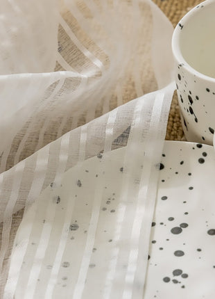 a coffee cup sitting on top of a table