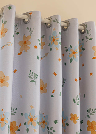 a close up of a curtain with flowers on it