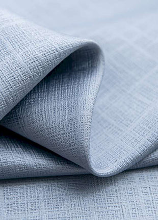 a close up of a light blue fabric