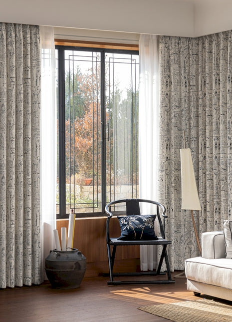 a living room filled with furniture and a large window