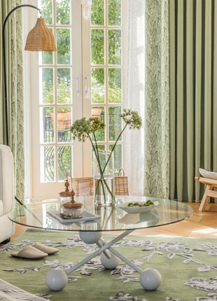 a living room filled with furniture and a large window