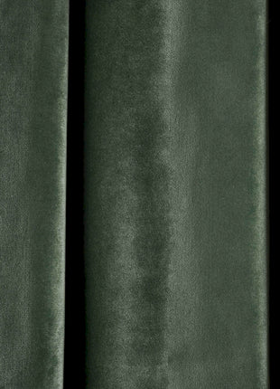 a close up of a green velvet curtain