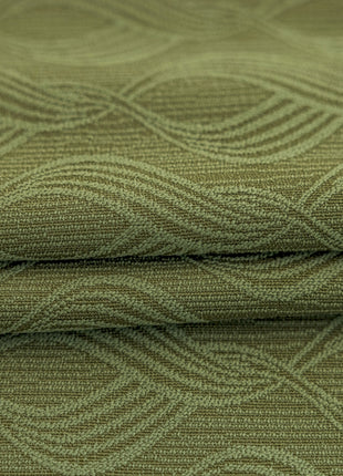 a close up view of a green fabric