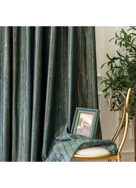 a picture frame sitting on a chair next to a curtain
