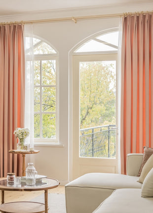 a living room filled with furniture and a large window