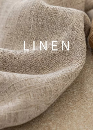 linen is laying on top of a table