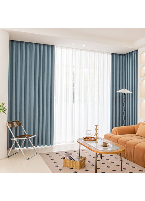 a living room filled with furniture and a large window