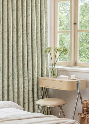 a bedroom with a bed, desk, and two windows