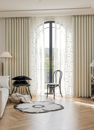 a living room filled with furniture and a large window