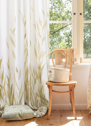 a chair sitting next to a window in a room