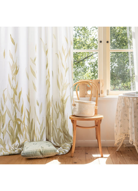 a chair sitting next to a window in a room