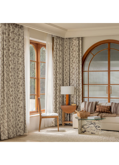 a living room filled with furniture and a large window