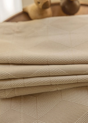 a close up of a folded sheet on a table