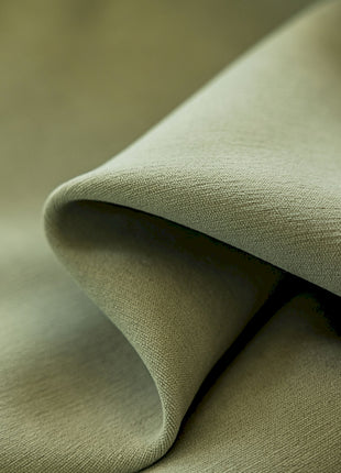 a close up view of a green fabric