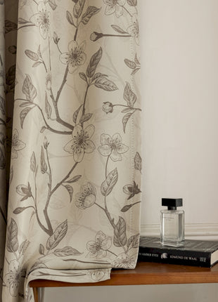 a table with a book and a perfume bottle on it