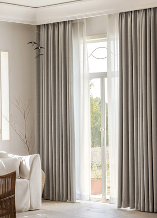 a living room filled with furniture and a large window