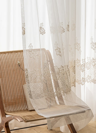 a pair of chairs sitting in front of a window