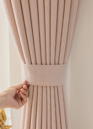 a person is pulling up a curtain with their hand