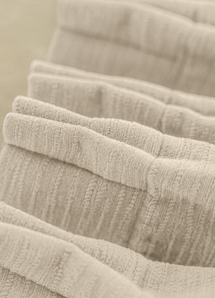 a row of folded towels sitting on top of each other