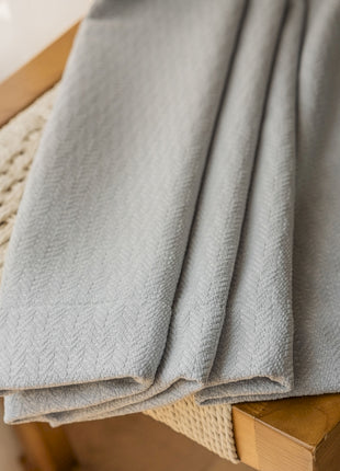 a close up of a blanket on a chair