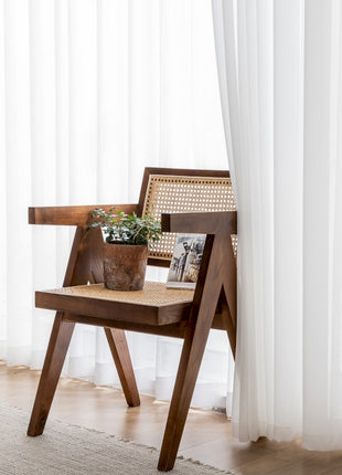 a chair with a potted plant sitting on top of it