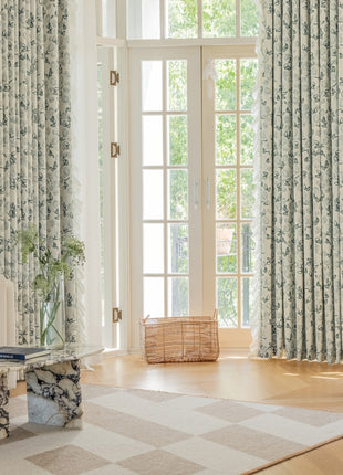 a living room filled with furniture and a large window