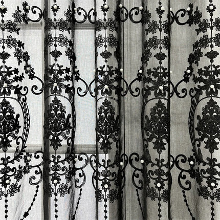 a black and white photo of a curtain