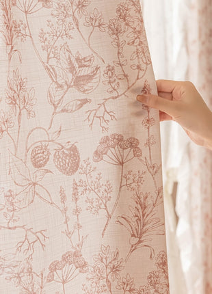 a person holding a curtain with a flower pattern on it